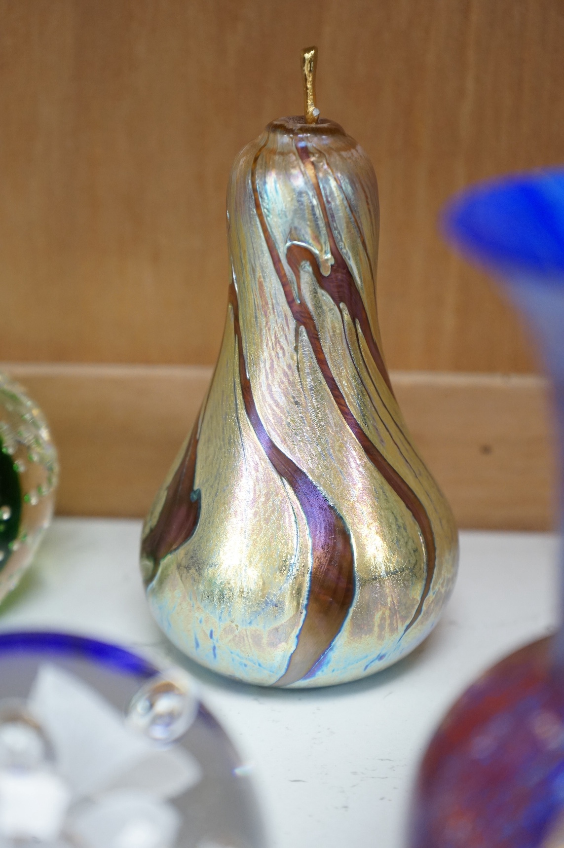 A group of modern iridescent glass vases and paperweights, tallest 14cm. Condition - mostly good